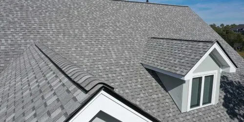 Aerial view of roof work done on a home.